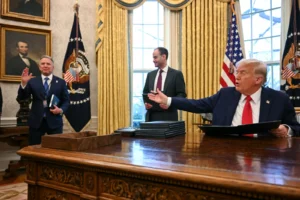 President Trump gestures to Steve Witkoff while signing an executive order to create a U.S. sovereign wealth fund on Feb. 3, 2025. Jim Watson/AFP